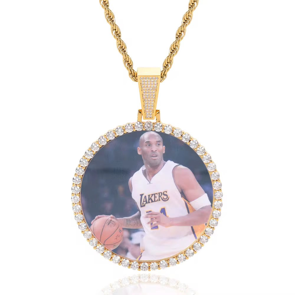 Portaretrato circular bañado en oro de 18k
