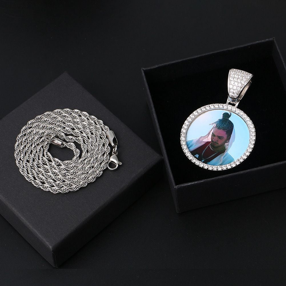 Portaretrato circular bañado en oro de 18k