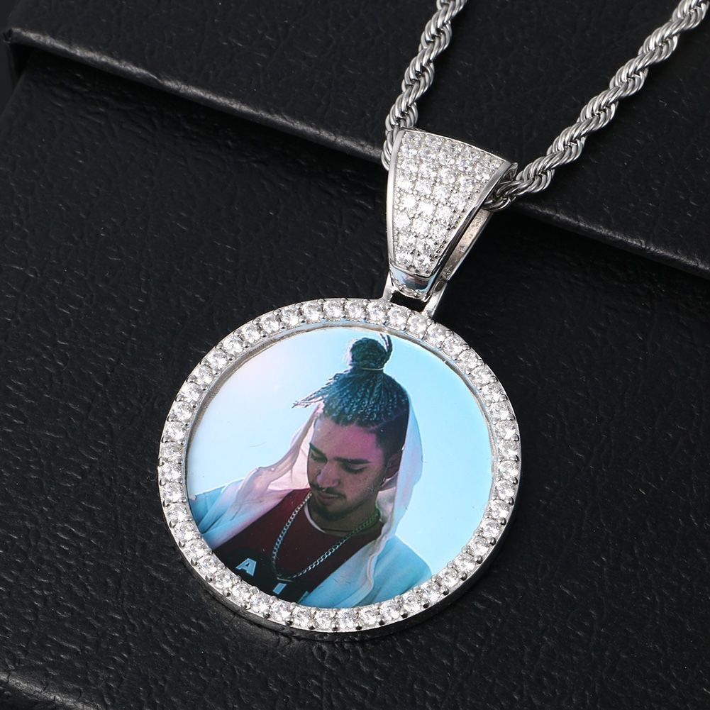 Portaretrato circular bañado en oro de 18k